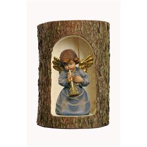 Bell angel with trumpet  in a tree trunk