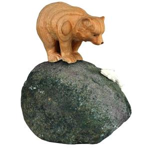Bear standing on stone