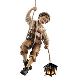 Boy rappeling with lantern