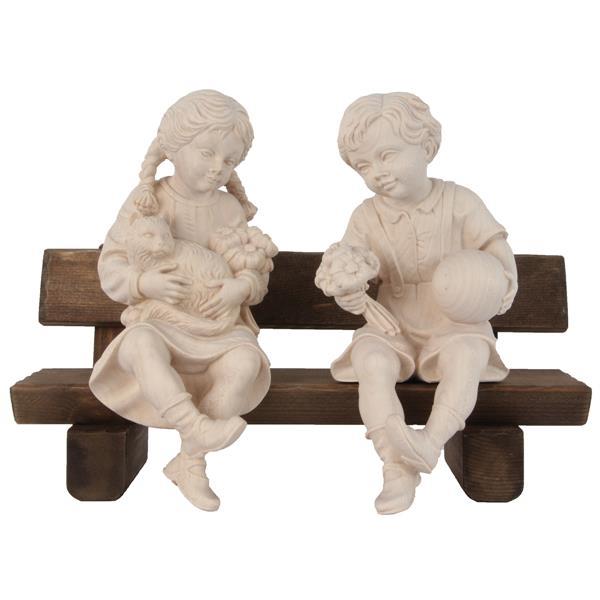 Boy and girl sitting on bench - natural